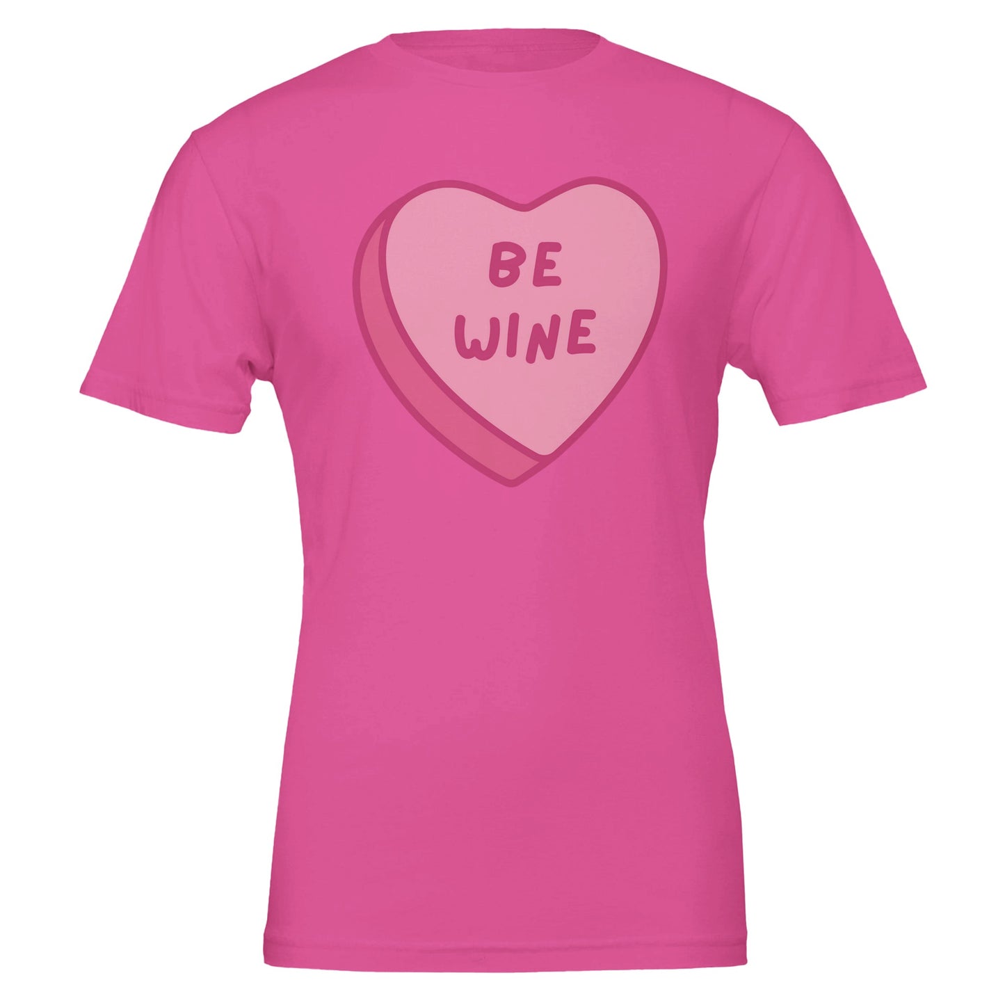 Pink T-shirt with a pink candy heart that says "Be Wine," perfect for wine lovers and Valentine's Day celebrations.