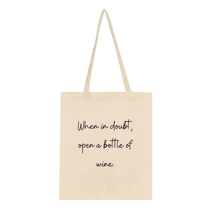 Canvas tote bag with the phrase 'When in Doubt, Open a Bottle of Wine' in bold, stylish lettering. Perfect for wine lovers, featuring a spacious design ideal for carrying bottles, groceries, or everyday essentials.