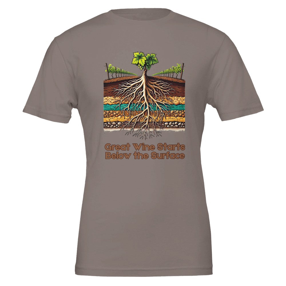 Earth-toned T-shirt with a colorful illustration of grapevine roots extending through various soil layers, accompanied by the phrase "Great Wine Starts Below the Surface", emphasizing the importance of terroir in winemaking.