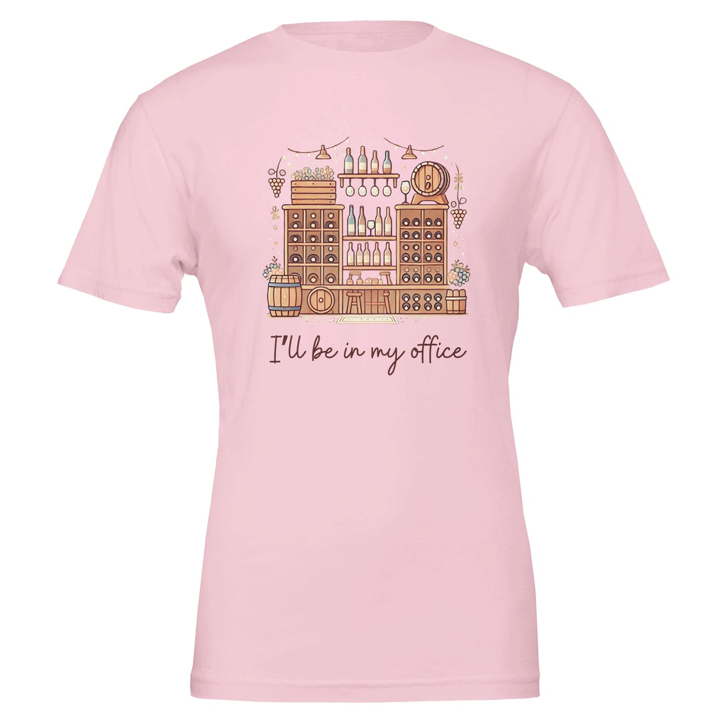 A light pink T-shirt featuring an intricate illustration of a wine cellar with barrels, shelves of bottles, hanging glasses, and the phrase "I'll Be in My Office" in a handwritten-style font.