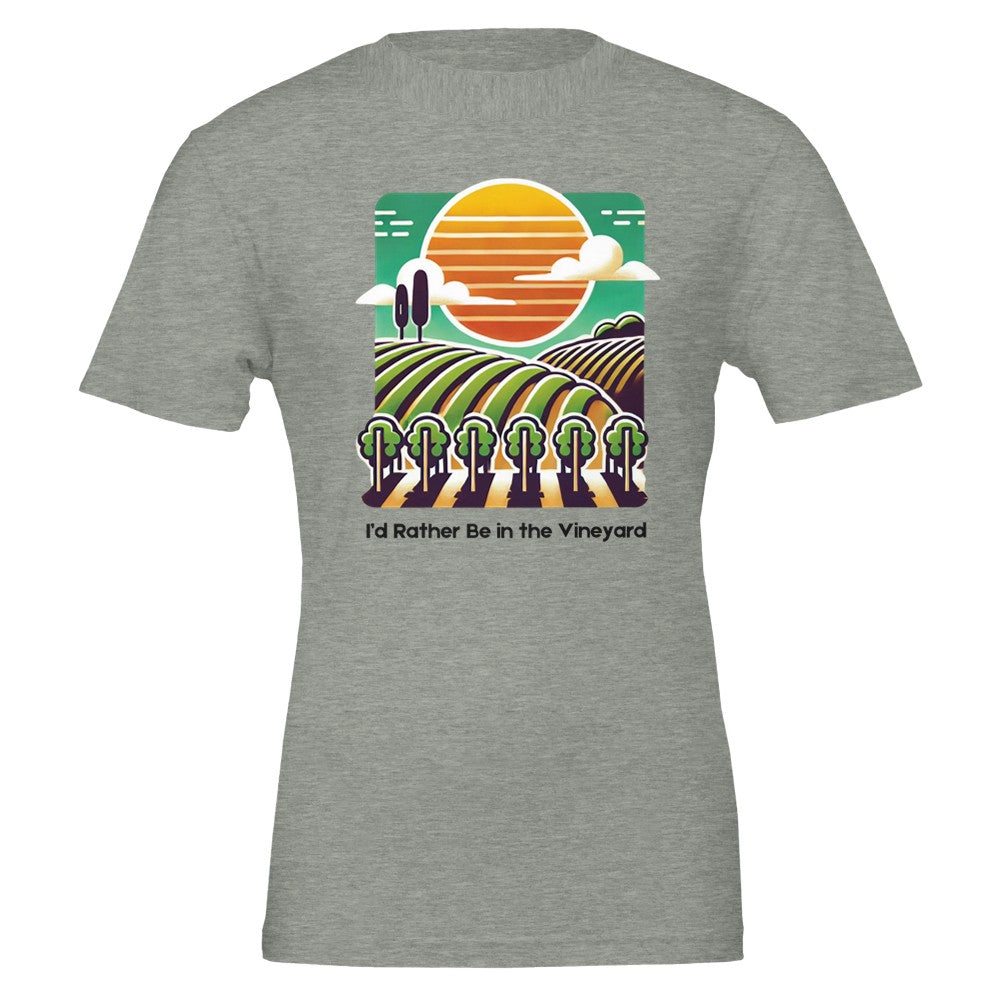 T-shirt featuring a colorful illustration of a vineyard with rolling rows of grapevines under a sunset, along with the phrase "I'd Rather Be in the Vineyard", celebrating vineyard life.