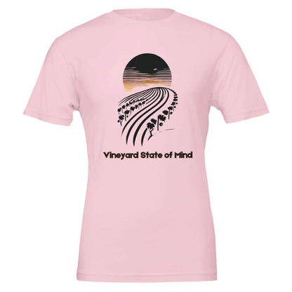 Pink T-shirt featuring a black silhouette of rolling vineyard rows under a sunset, with the phrase "Vineyard State of Mind", symbolizing a love for wine and vineyard life.