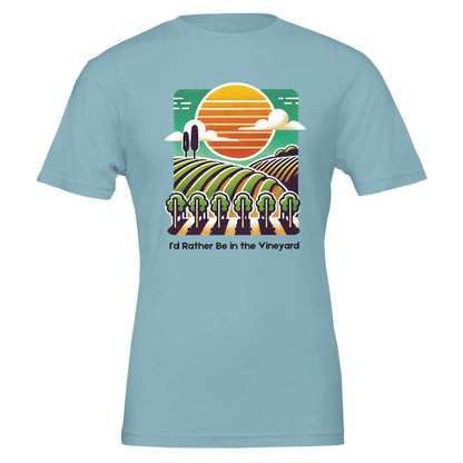 Light blue T-shirt featuring a colorful illustration of a vineyard with rolling rows of grapevines under a sunset, along with the phrase "I'd Rather Be in the Vineyard", celebrating vineyard life.