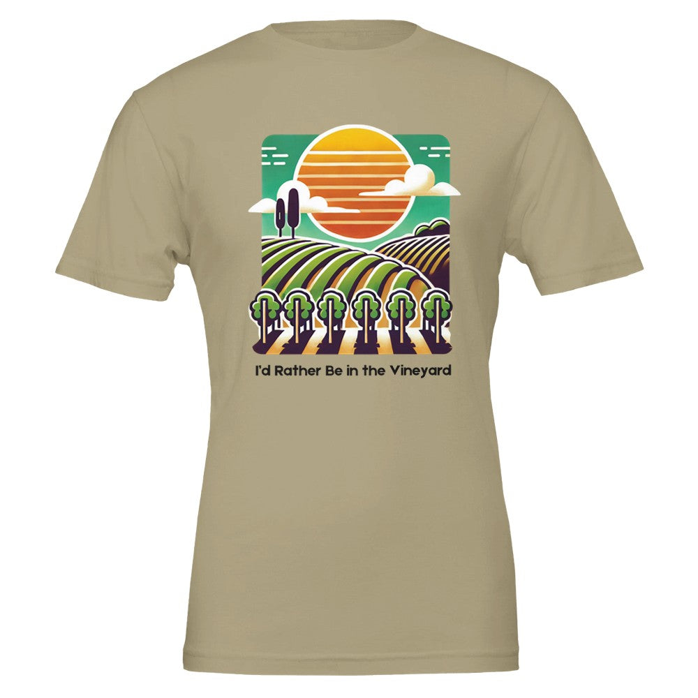 Tan T-shirt featuring a colorful illustration of a vineyard with rolling rows of grapevines under a sunset, along with the phrase "I'd Rather Be in the Vineyard", celebrating vineyard life.