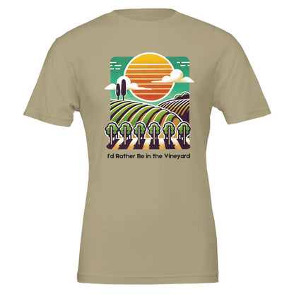 Tan T-shirt featuring a colorful illustration of a vineyard with rolling rows of grapevines under a sunset, along with the phrase "I'd Rather Be in the Vineyard", celebrating vineyard life.