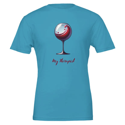 Teal T-shirt featuring a stylized illustration of a wine glass with swirling red wine and the phrase "My Therapist" in an elegant, playful font.