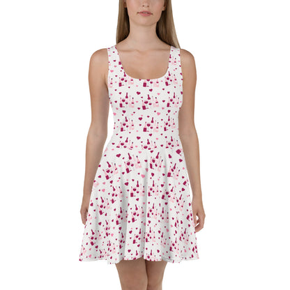 Sleeveless white dress with a red wine splash pattern, featuring flared skirt for a stylish and playful wine-inspired look.